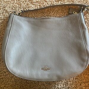 Coach leather purse, never used. Shoulder strap included.